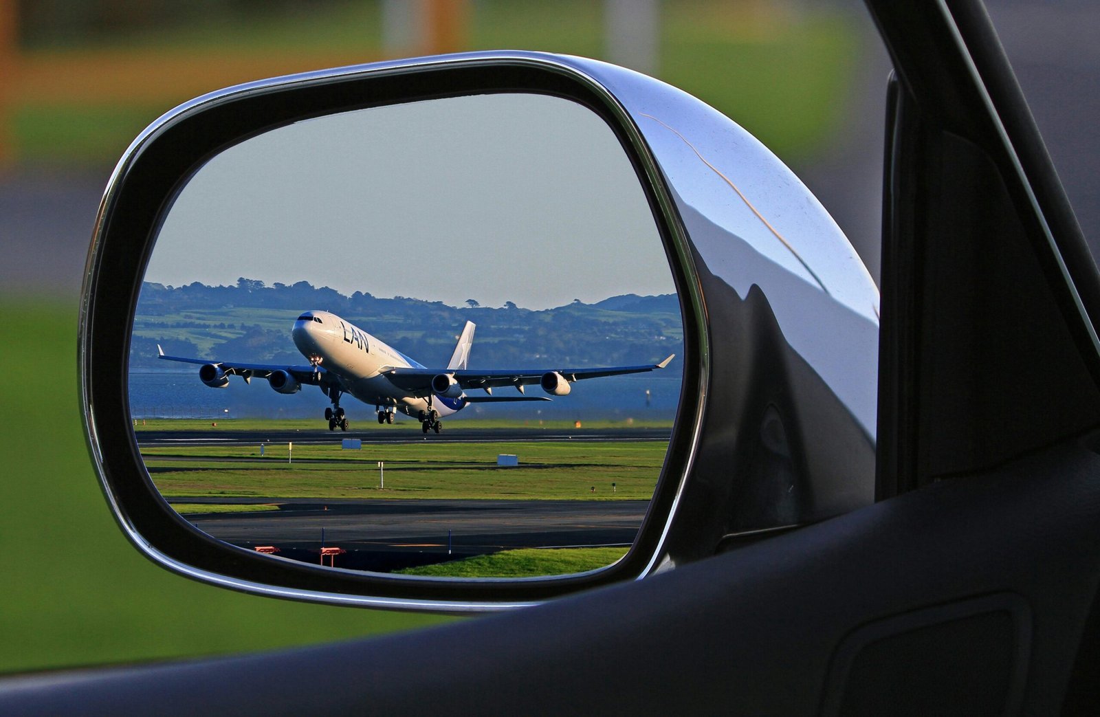 White Airplane Reflection on Car Side Mirror, Naples Airport Car Rental