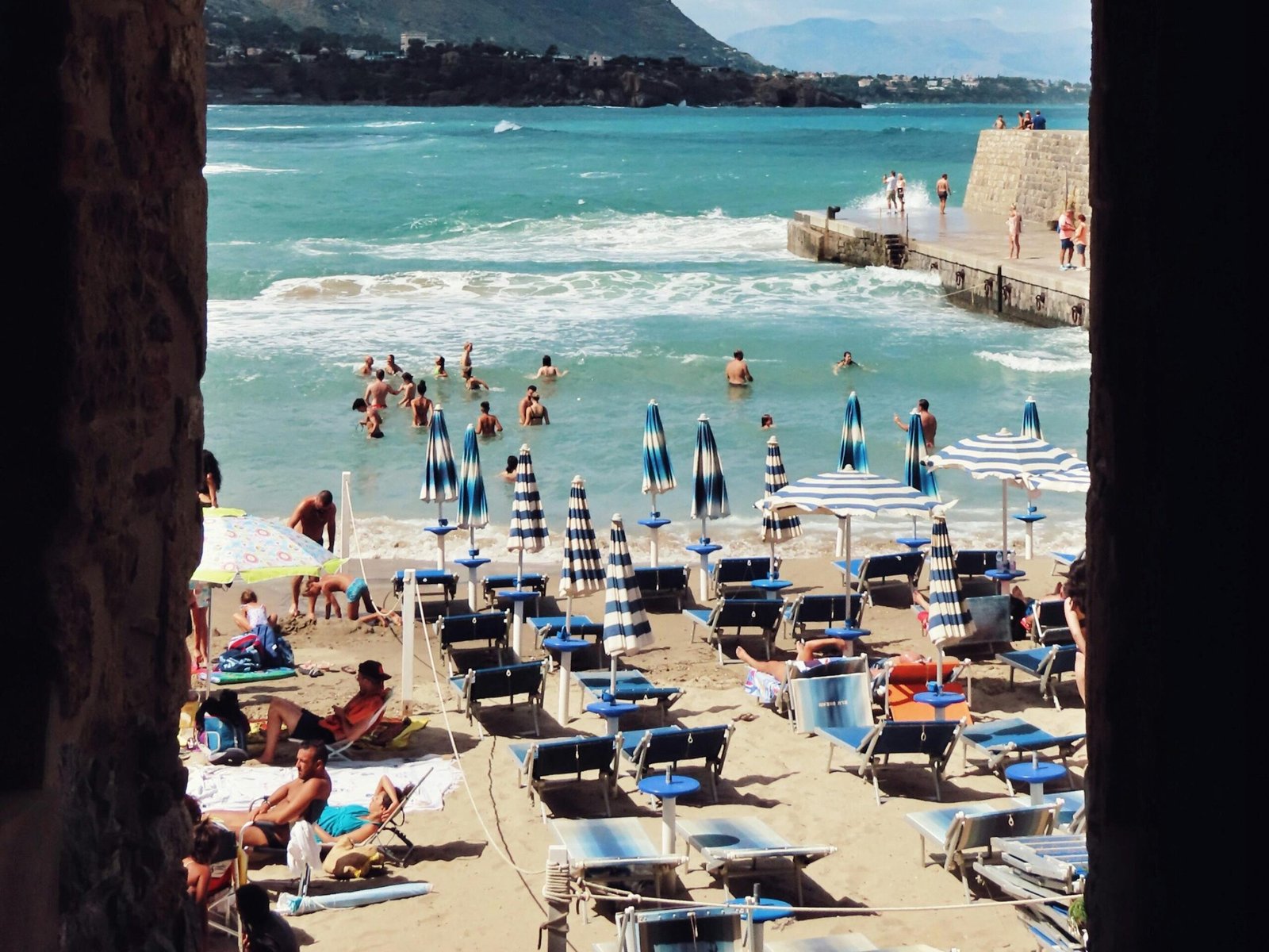 People on Beach in Cefalu in Italy