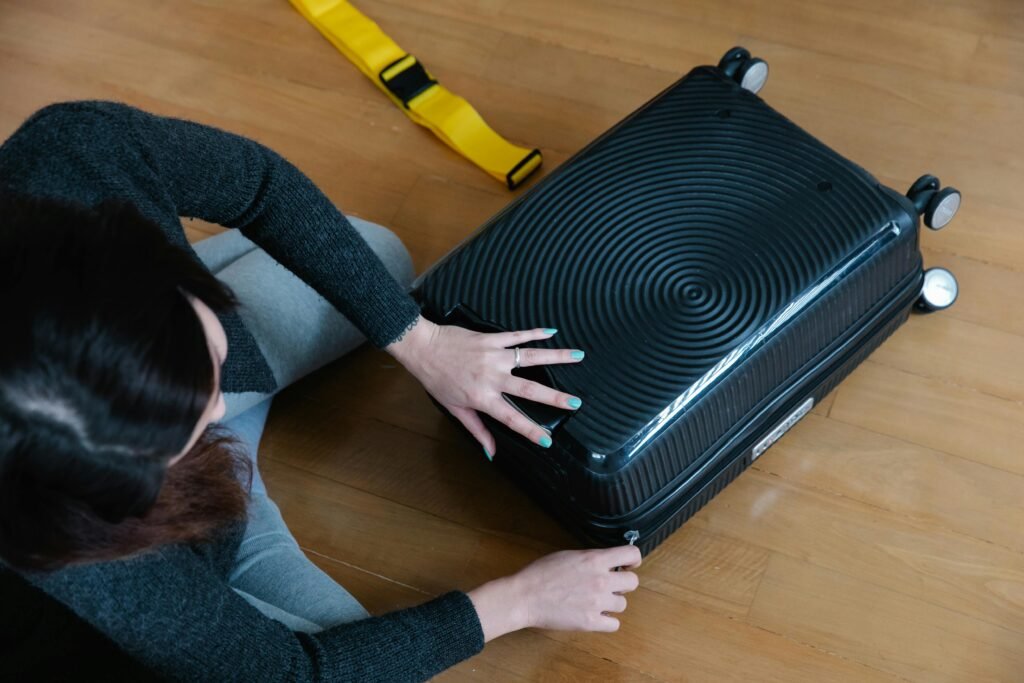 A Woman Zipping Her Luggage, and thinking is Palermo safe