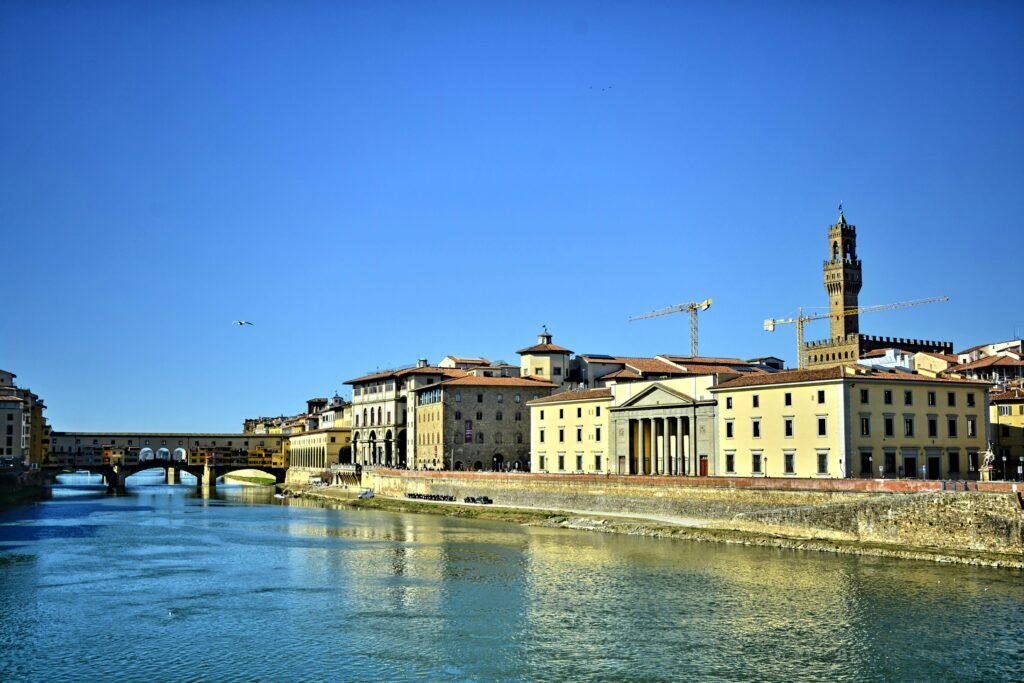 Yellow Concrete Buildings Beside Body of Water